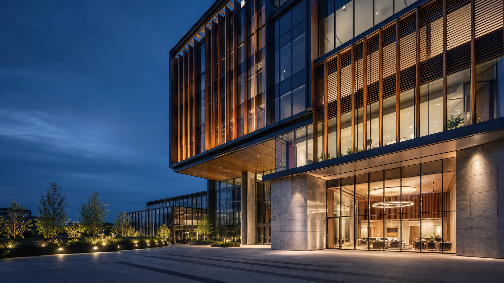 Contemporary commercial building showcasing coordinated glass, steel, stone, and architectural metal systems